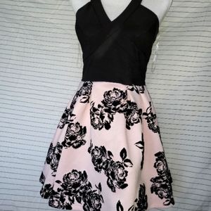 Pink and black floral dress with mesh back. Size 7. Wore once.